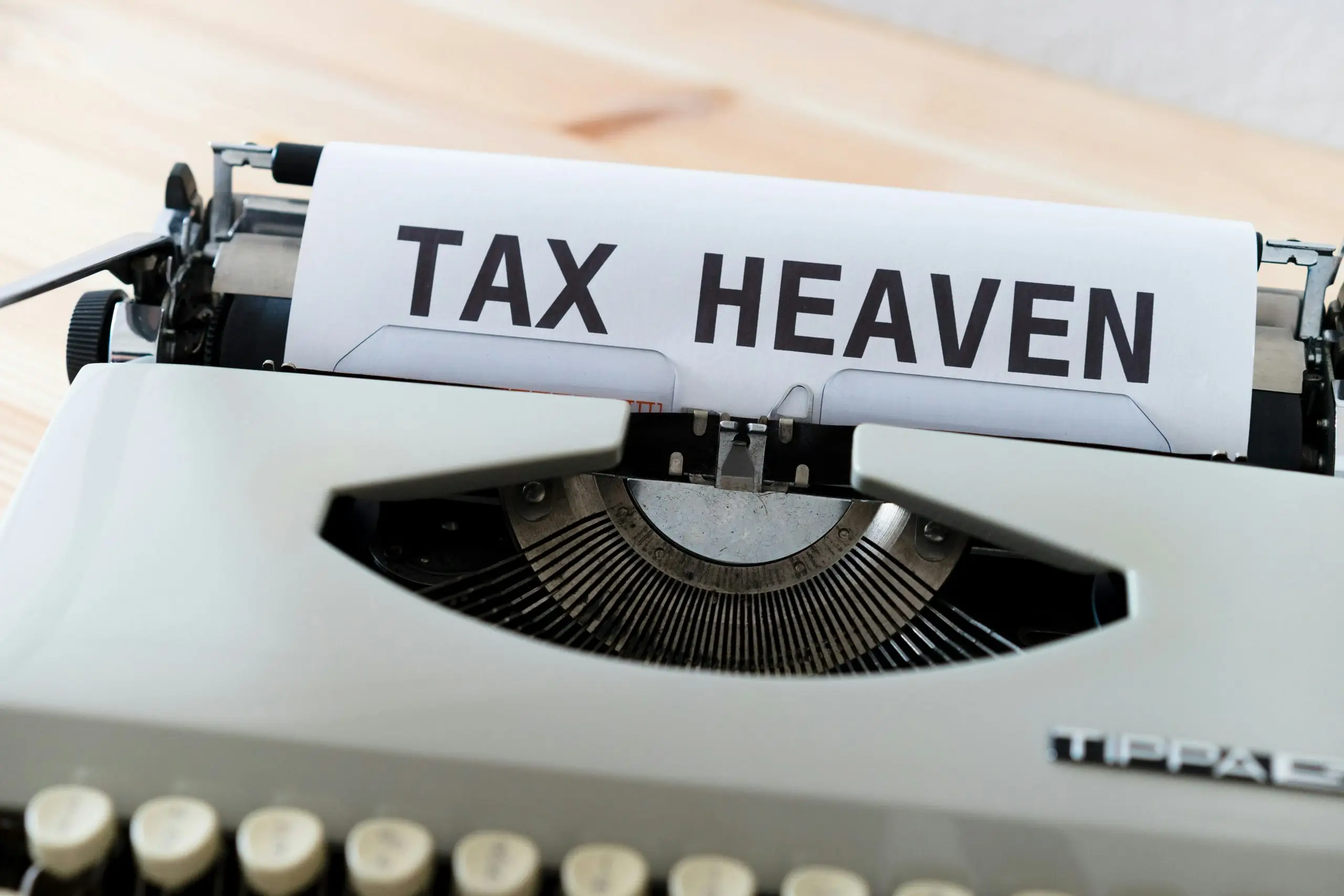 A typewriter with a paper that reads "TAX HEAVEN."