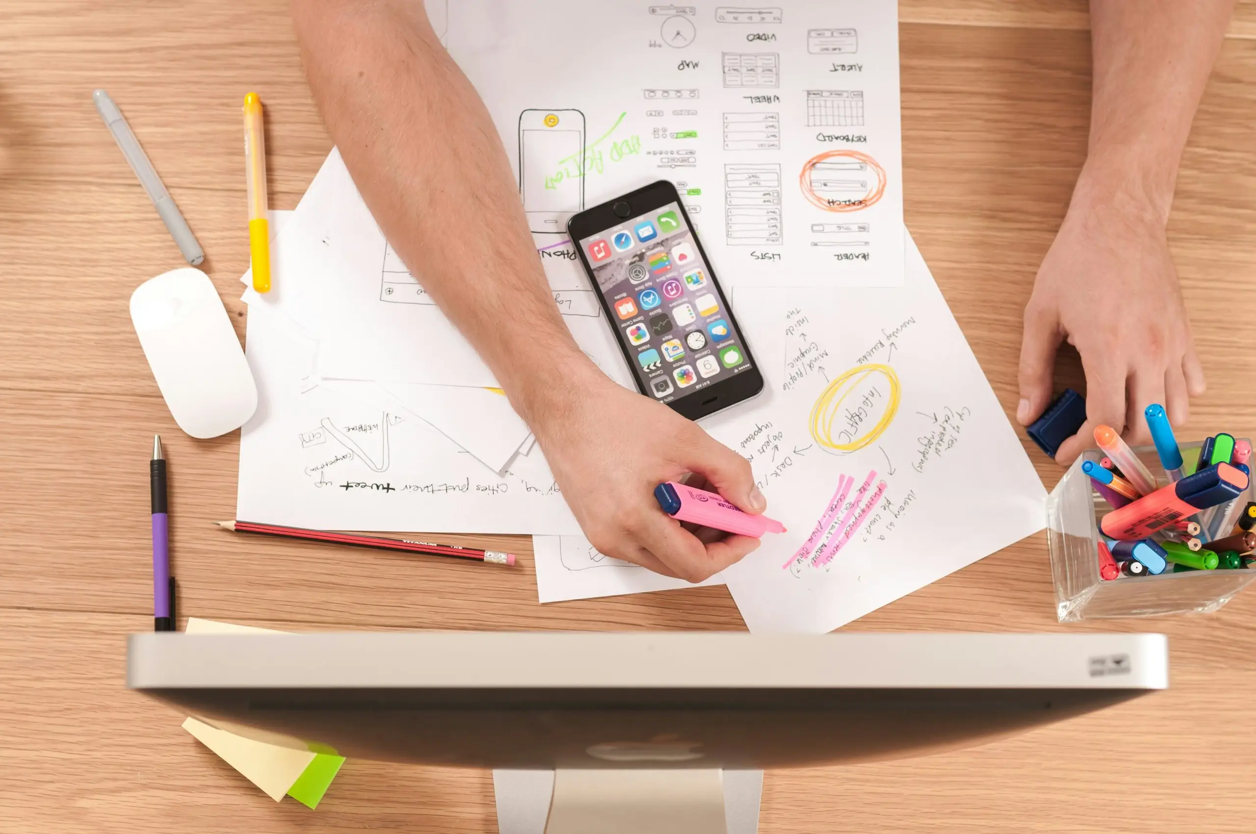 A workspace with tax documents and a smartphone.
